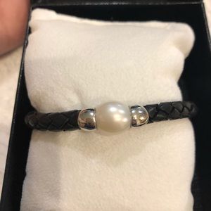 Black leather and pearl bracelet.